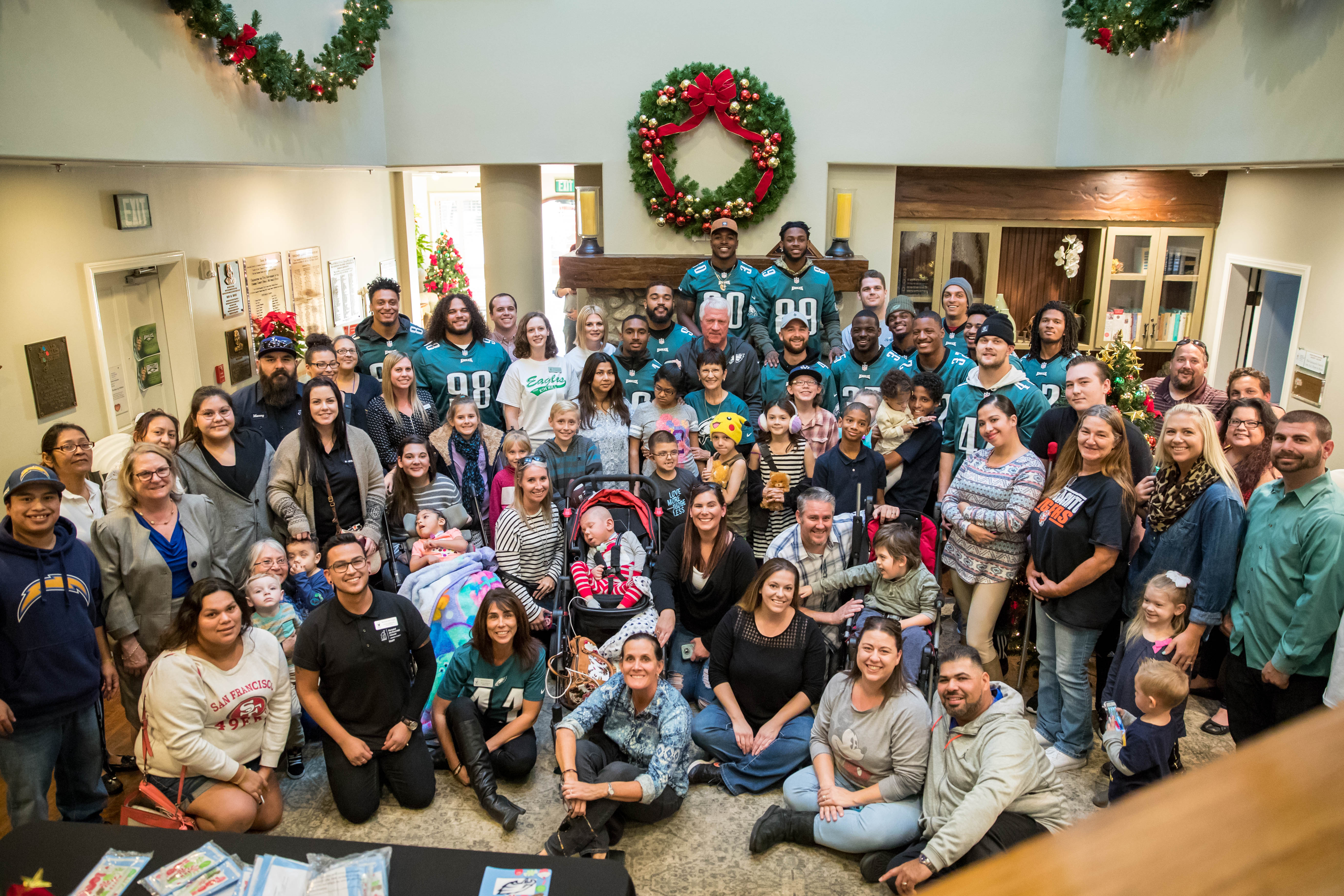 group photo from the Philadelphia Eagles visit of the Orange County Ronald McDonald House